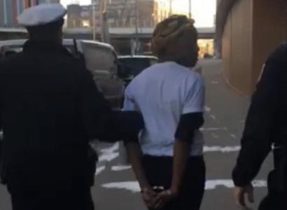 Black woman being arrested