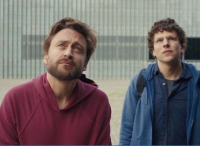 Two men staring up to the sky