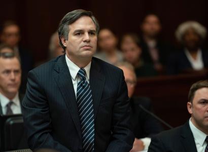 White guy in a suit looking serious