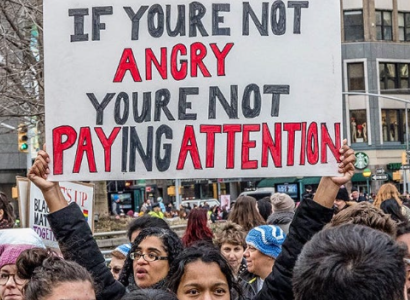 Sign saying If you're not angry, you're not paying attention