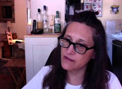 Woman with brown hair and glasses