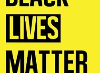 Yellow background with black words saying Black Lives Matter