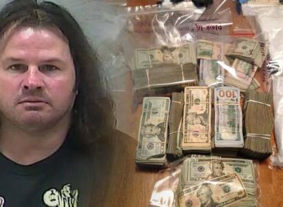 Mug shot of disheveled white guy with long hair next to money and drugs