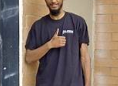 Young man giving a thumbs up sign