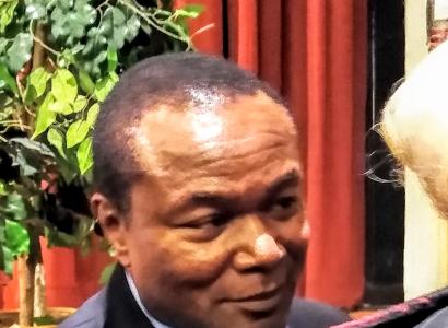 Black man deep in conversation