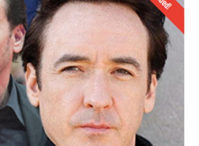 White man's face looking squinty eyed toward the camera without a smile 