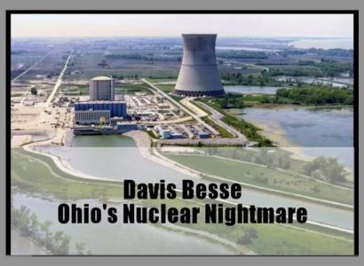 A large conical shaped cement building with other little buildings around and river of water leading to it with the words Davis Besse Ohi's Nuclear Nightmare