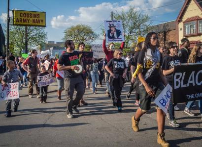 Photo of protestors marching down High Street