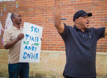 Man with protest sign