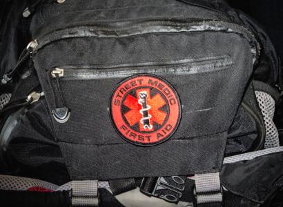 Black medic bag with red First Aid symbol on it