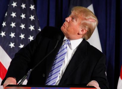 Donald Trump at podium looking sideways and stupid