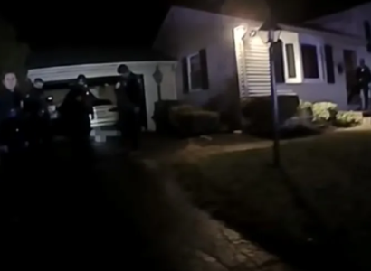 Police outside a house at night
