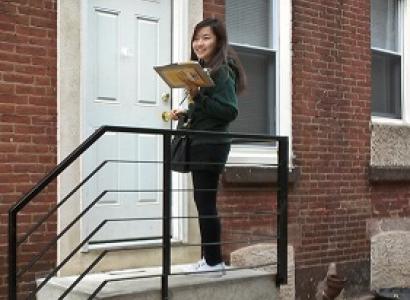 Woman standing outside a door