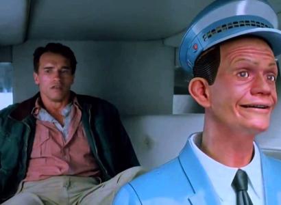 Man in a car with a dummy driving