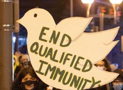Sign at protest sayind End Qualified Immunity