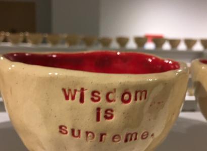 Coffee mug that says Wisdom is something