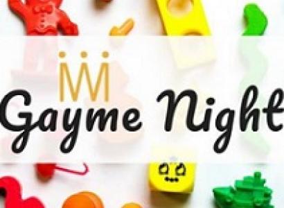 Colorful toys in the background and words in script in front Gayme Night