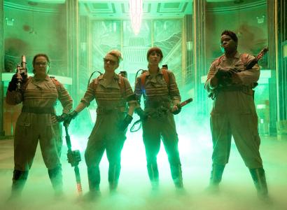The three women in uniforms with ghost busting guns and foggy stuff around their feet