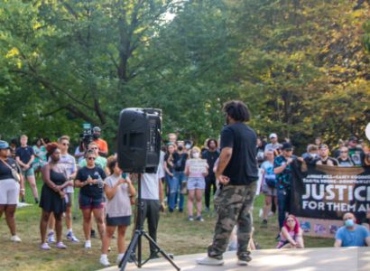 Speakers and crowd by gazebo