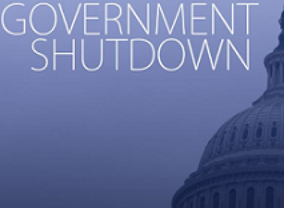 Top side of a capitol building and words Government Shutdown