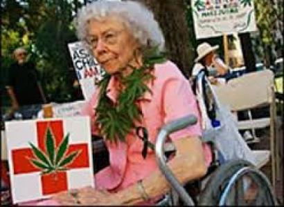 Elderly woman with marijuana sign