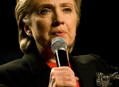 Hillary Clinton talking into a mic