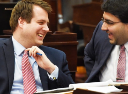 Two white men laughing