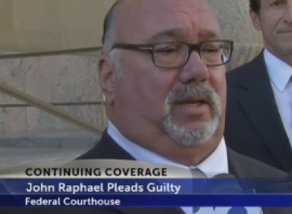 Older man with glasses and a gray goatee