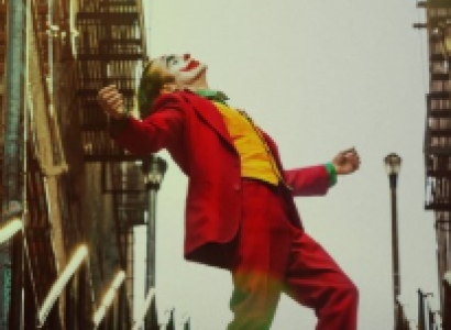Movie poster from Joker movie with Joker outside leaning back with arms spread wide