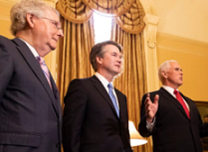 Three white guys in suits looking important