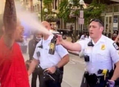 Protestor being maced