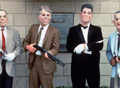 People dressed as presidents in masks with guns