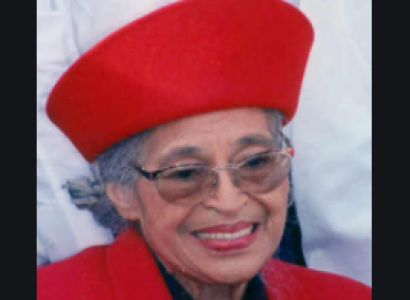 Older woman in red hat