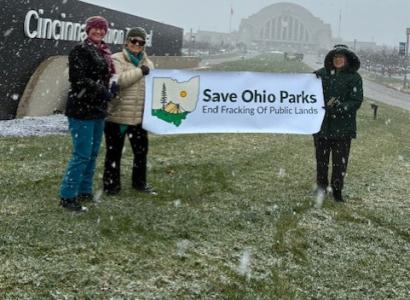 People holding Save Ohio Parks banner