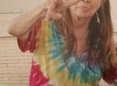 Margaret Sarber making a peace sign