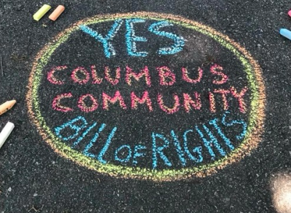 Chalk words on ground Yes Columbus Community Bill of Rights