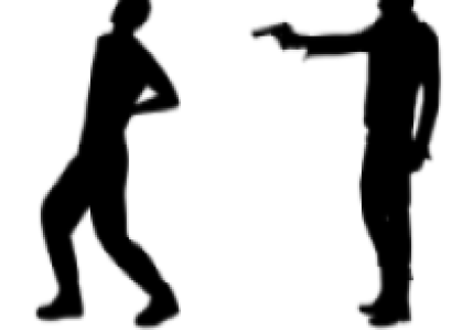 Silhouette of a man shooting another man