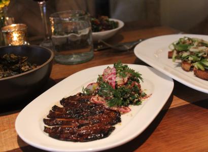 Brussels sprouts (front left), grilled Portobello mushroom (front center), toast (front right), kale and roasted vegetables (rear center)  