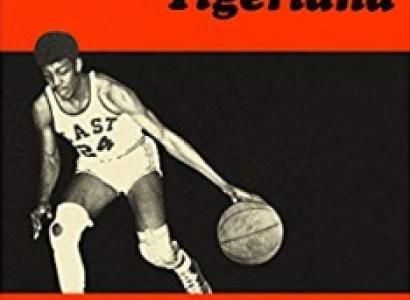 Top part of book cover with a guy playing basketball and the word Tigerland