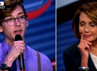 Trevor Hills talking into a mic on one side and Nancy Pelosi looking down on the other side