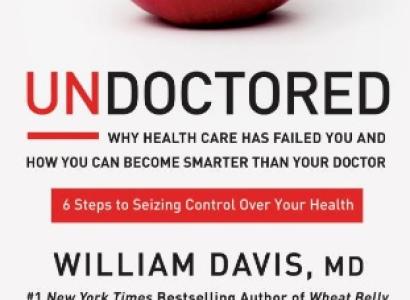 Cover of Undoctored book, with an apple with a prescription pasted on it