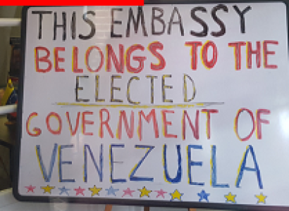A sign saying This embassy belongs to the elected government of Venezuela