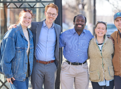 Jesse Vogel with four volunteers