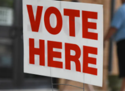 Vote here sign
