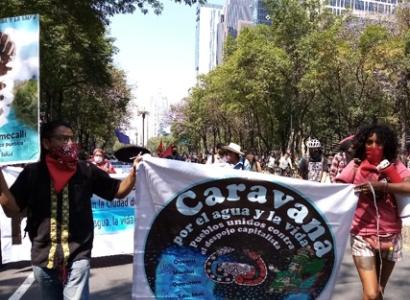 People marching holding sign