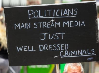Sign saying Politicians, mainstream media, just well dressed criminals