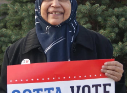 Zerqa holding sign