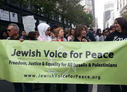 People holding a Jewish Vices for Peace banner
