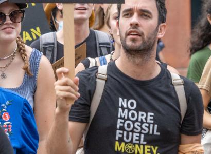 Man holding protest sign