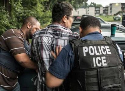 Ice police arresting a man